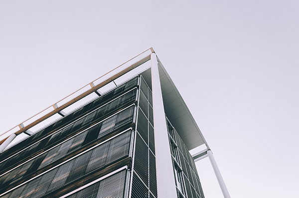 Low angle shot of the corner of a high business building the corner of a high business